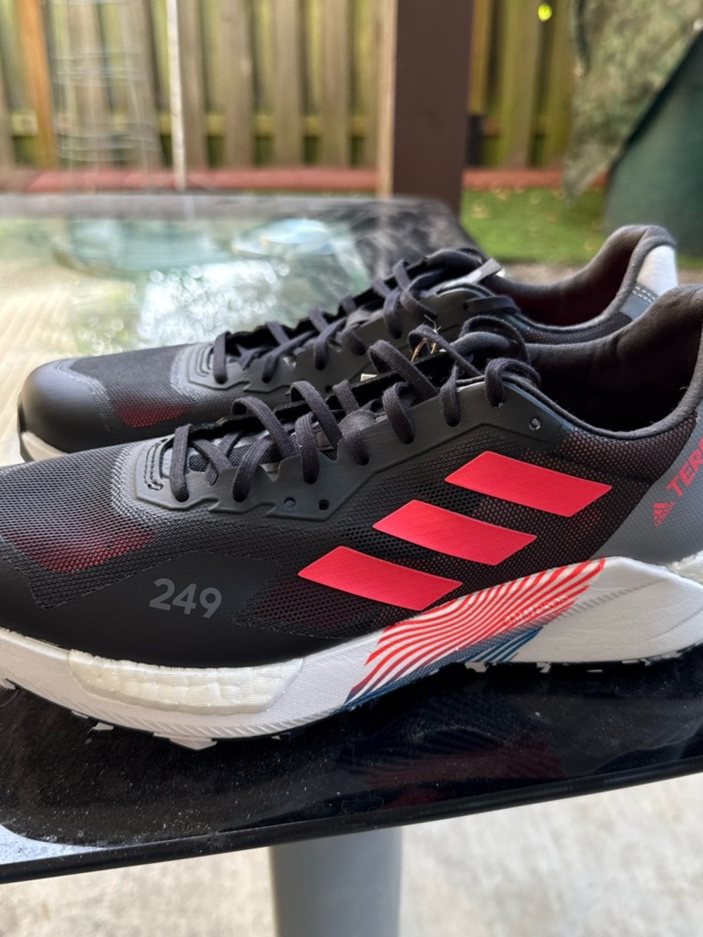 adidas Black Sneakers with Red Accents and White Sole
